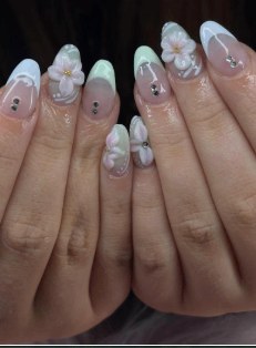 Clear nails with white 3D floral details and gems
