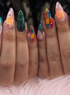 Abstract patchwork nail art with colorful blocks and shapes